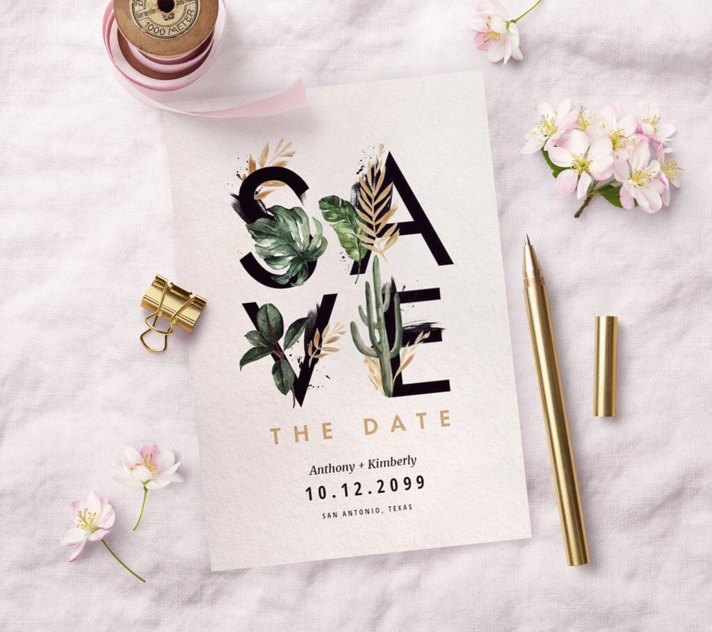 Save the Date Wedding Design: 'Save' in Bold Letters with Plant Illustrations, Set on White Surface with Gold Pencil, Flowers, and Ribbon Roll.