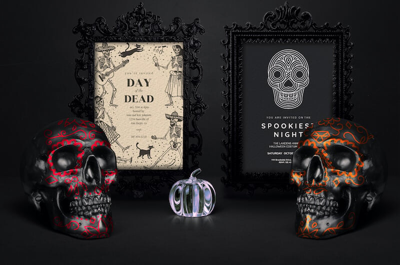 Ornate black photo frames holding Halloween invitations against a dark backdrop. Adjacent to each frame, a black skull adds a spooky touch, while a central crystal pumpkin gleams.