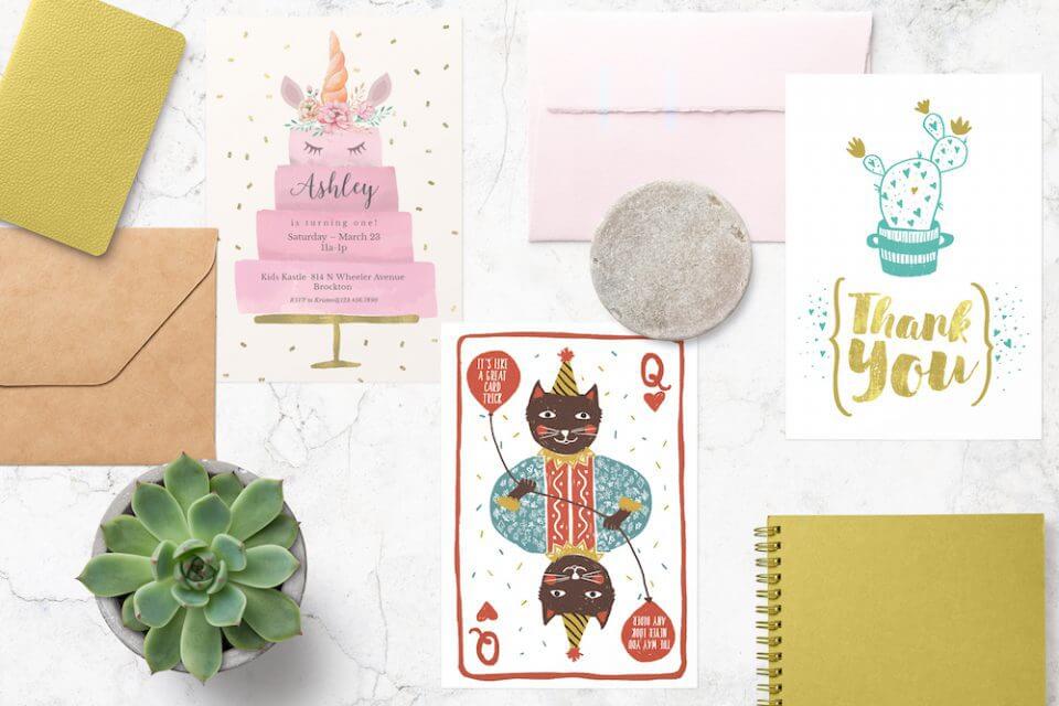 An elegant display of Snežana Pupović's gratitude and birthday card designs for Greetings Island, tastefully laid out on a marble surface. The arrangement includes a plant pot, coordinating envelopes, and a notebook, creating a harmonious and stylish presentation.