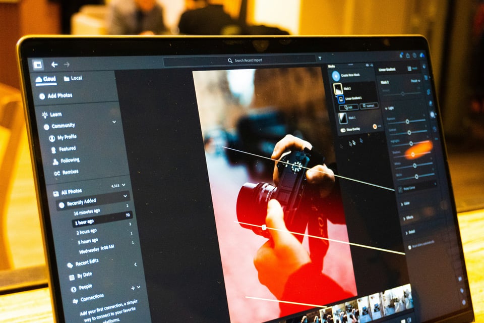 editing-photos Photo editing software open on laptop screen with camera image being adjusted and enhanced.