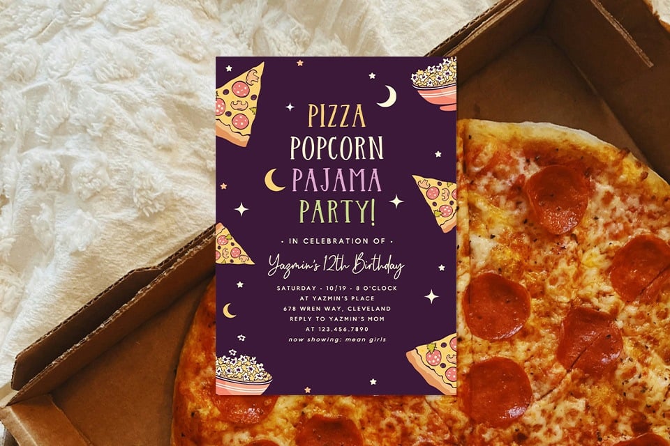 sleepover-party-invite-pizza- (1) Teen sleepover birthday party invitation reading “Pizza Popcorn Pajama Party!” placed on an open pepperoni pizza box, styled with cozy blankets and late-night movie vibes for a pajama party celebration.