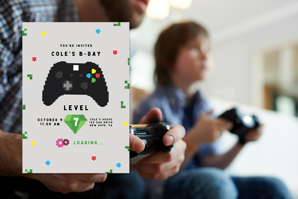 video-game-console-birthday-invite Video game–themed kids birthday invitation featuring a pixel-style game controller and retro graphics reading “Cole’s B-Day, Level 7,” set against a blurred background of a child and adult playing with video game controllers at home.