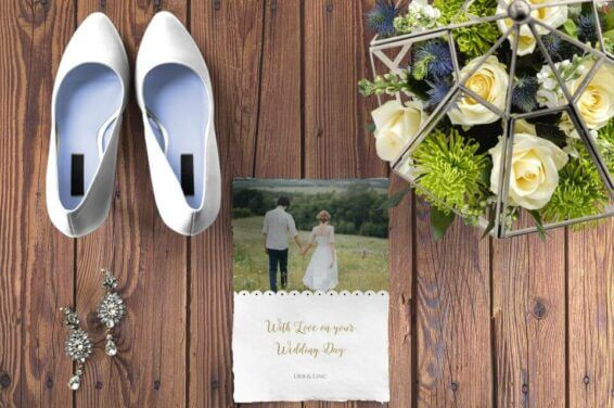 Sophisticated Wedding Card, White Shoes, and Bouquet on a Gleaming Wooden Table. A Blend of Modern Elegance with Rustic Warmth.