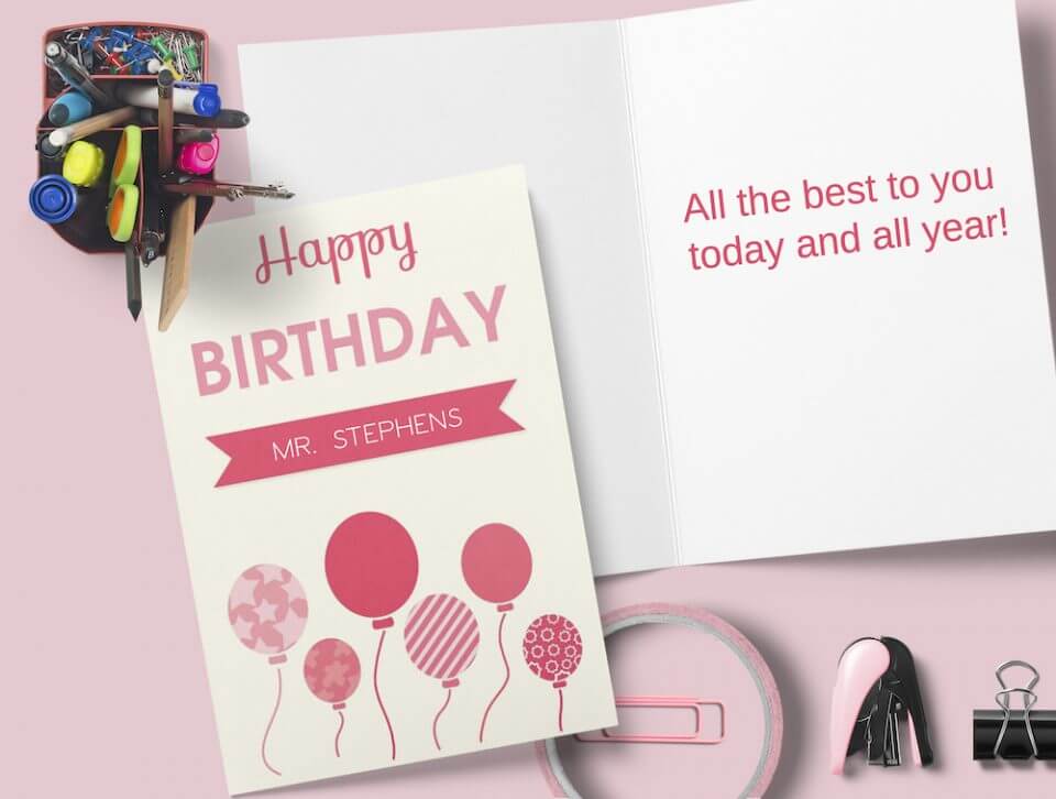 Cheerful Birthday Greetings: Pink Balloon Illustrations and 'Happy Birthday' in Pink Text, Set on a Pink Surface with Office Elements Nearby