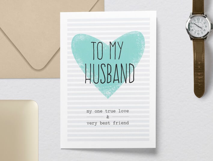 Heartfelt Birthday Wishes & Card Message for My Husband: 'To My Husband' in Bold Black Font Atop a Loving Green Heart Drawing, Against a Light Grey and White Striped Background. Paired with a Timeless Watch and a Neatly Sealed Envelope.