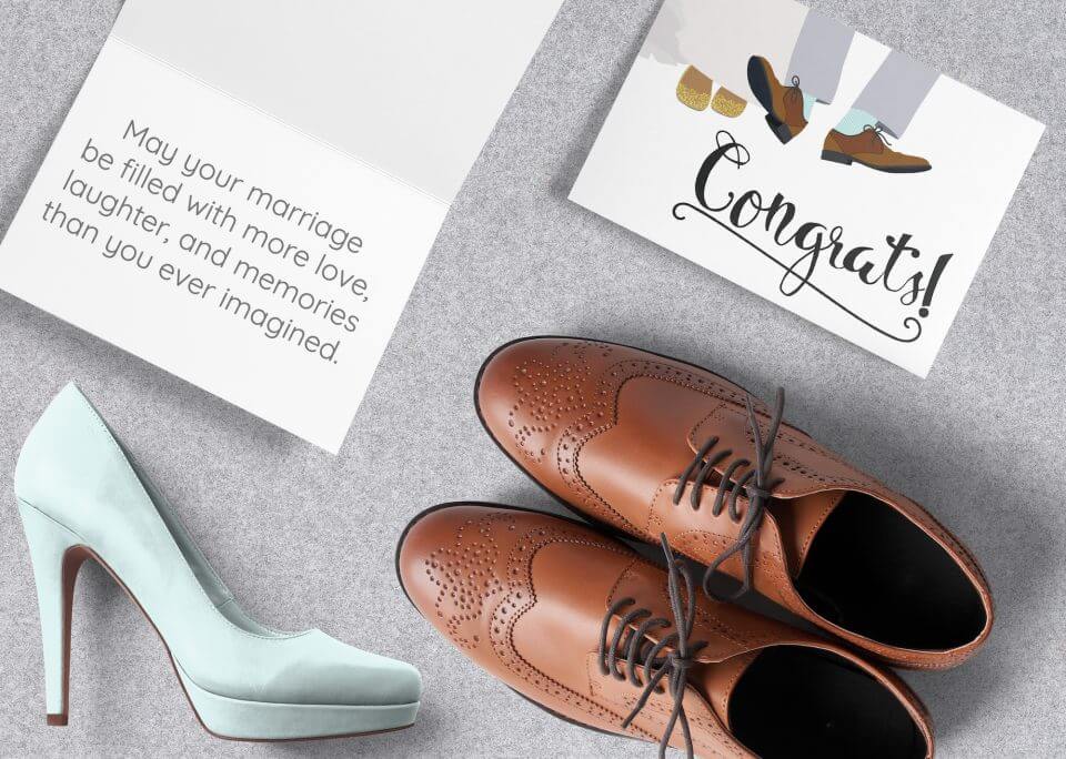 A Wedding Congratulations Card Celebrating 'Him and Her,' Featuring an Illustration of the Groom and Bride's Feet with Their Elegant Wedding Shoes – Alongside a Woman's Shoe Heel and a Man's Smart Shoe, a Symbol of Love and Union.