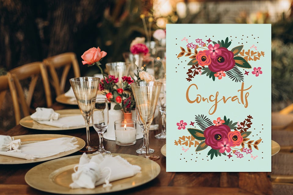 congrats-retirement-card-floral Floral congratulations card displayed on elegant dinner table with colorful flowers and gold script “Congrats” design.