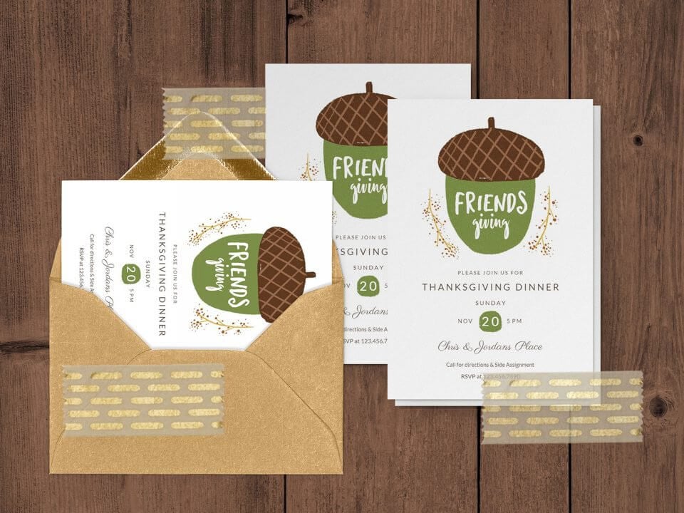 Friendsgiving Invitations with Elegant Acorn Illustration for Thanksgiving Dinner. Invitations are Stacked on Wooden Surface, Minimalistic and Refined.