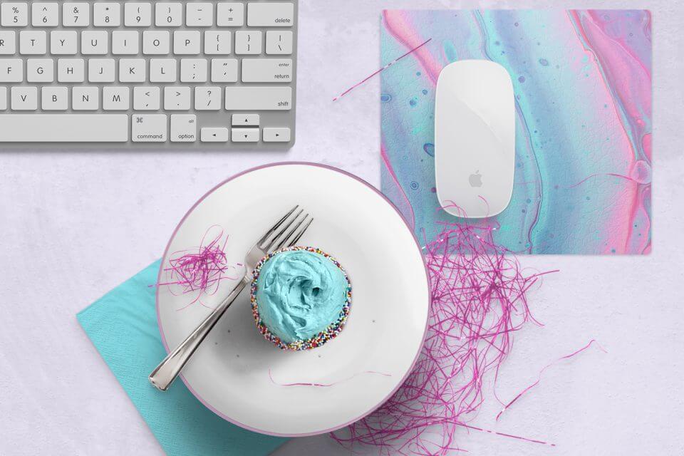 Mastering the Virtual Party Blueprint: Elevate your virtual birthday celebration with a delectable cupcake placed next to a keyboard and mouse, igniting the perfect online festivity.