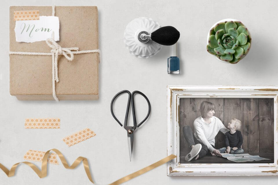 Ways to Express Love: Craft a Thoughtful Care Package – Featuring a Heartfelt Note to Mom, a Cherished Photograph in a Frame of Mother and Child, a Lush Plant Pot