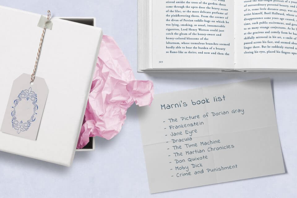A book, a paper with notes and a list, presented as a thoughtful gift with a tag that conveys care and consideration.