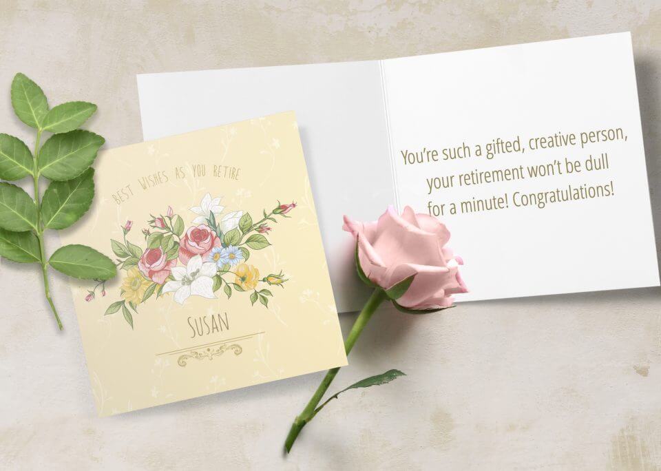 Floral Happy Retirement Wishes Messages: A Yellow Background Card Featuring Colorful Flower Drawings – Laid Beside an Open Card with a Thoughtful Note and a Graceful Pink Rose.