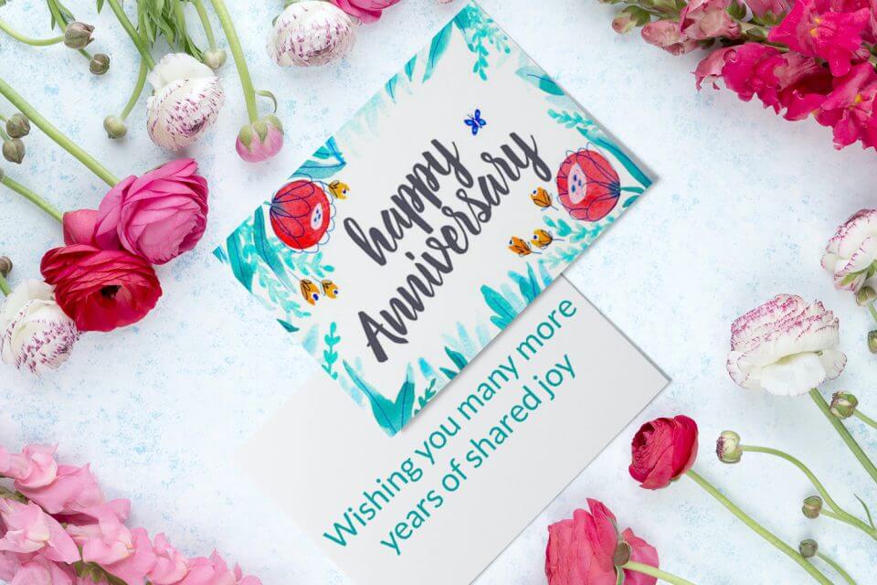 Convey your heartfelt wishes for a Happy Anniversary with a stunning watercolor floral card in shades of red, teal, and turquoise, featuring delicate flowers for an extra touch of elegance.