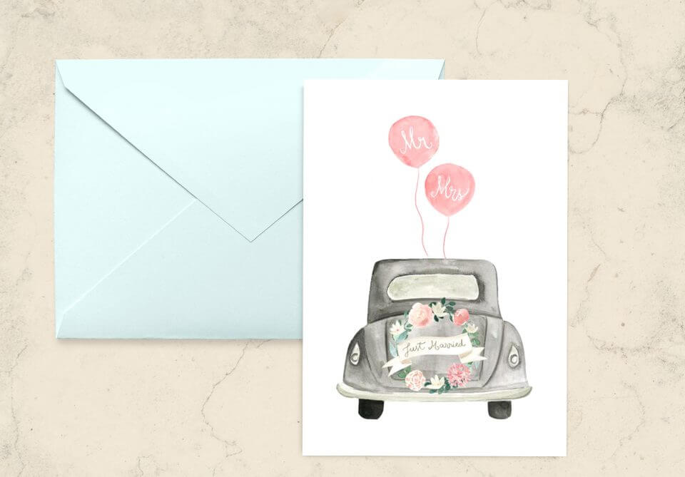Just Married card showcasing a classic old-timer car adorned with a floral wreath, complemented by two balloons playfully labeled 'Mr' and 'Mrs' to celebrate the newlyweds' journey ahead.