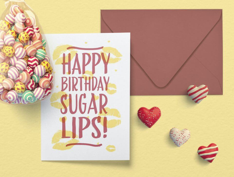 Playful Birthday Greetings for My Beloved Wife: 'Happy Birthday Sugar Lips' in Burgundy, Adorned with Vibrant Yellow Lip Prints. Accompanied by a Sweet Candy Bag and Cheerful Hearts, Adding Extra Joy to Your Special Day!