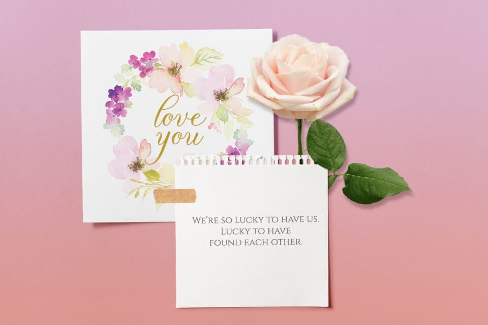 Sweet Circle Watercolor Floral Love Card: 'Love You' in Elegant Gold at the Center. Resting on a Gradient Pink Surface, Adorned with a Light Pink Rose and a Thoughtful Note.