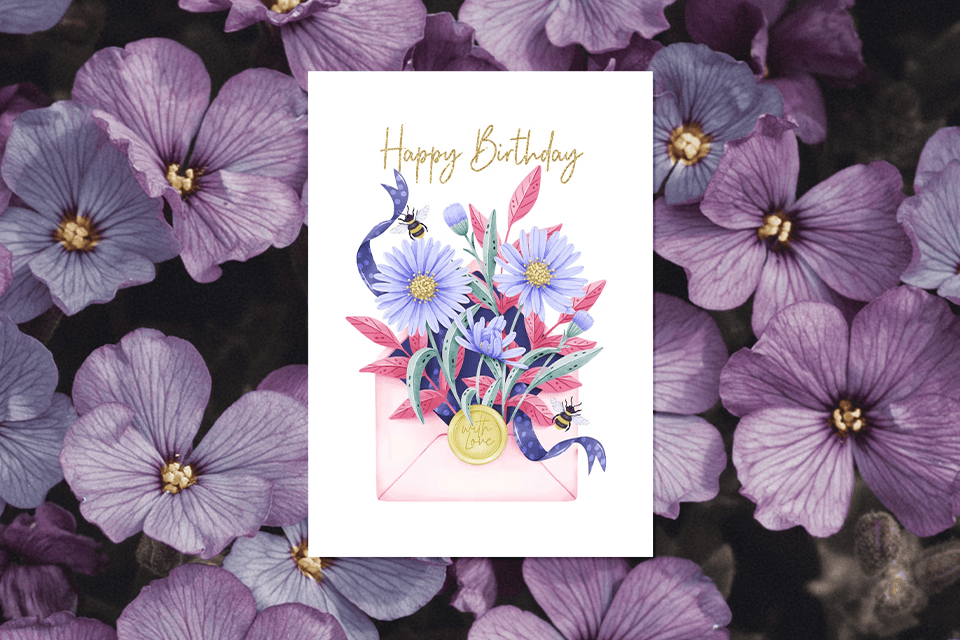 happy-birthday-purple-flower-card (1) Illustrated birthday card featuring a pink envelope filled with purple and blue flowers, leafy accents, small bees, and a crescent moon, set against a background of purple blossoms.