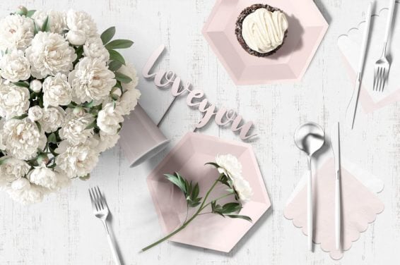 Romantic Wedding Anniversary Table Setting with White Flowers, Pink Plates, and Cupcake and words I Love You. Elegant and Serene Ambiance. Cover for '15 Wedding Anniversary Party Themes'