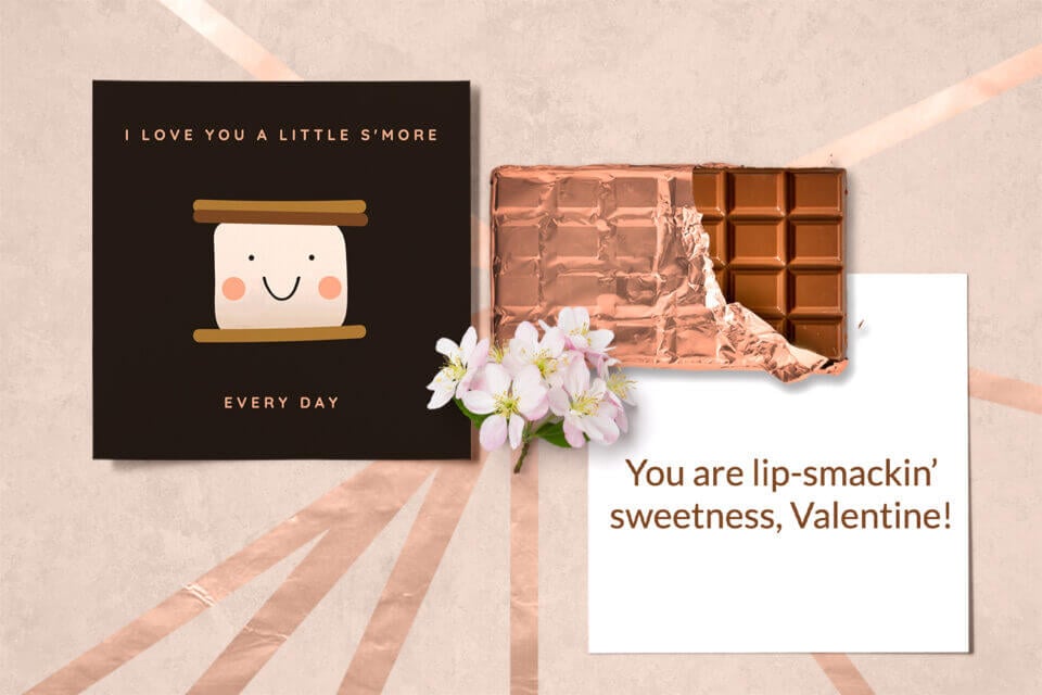 Valentine's Card Idea: 'I love you a little s'more every day'. Featuring a smiling s'more, with a heartfelt message. Paired with chocolate and a greeting-ready card.