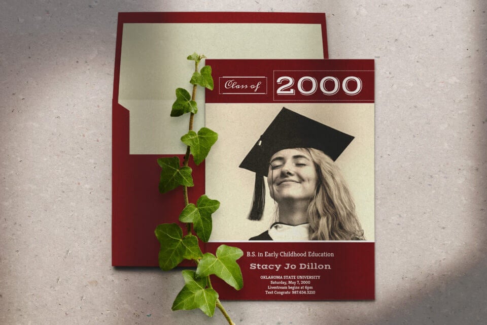 A red burgundy Graduation Announcement card featuring a prominent photograph of a woman proudly wearing a graduation cap. The design captures the essence of achievement and celebration