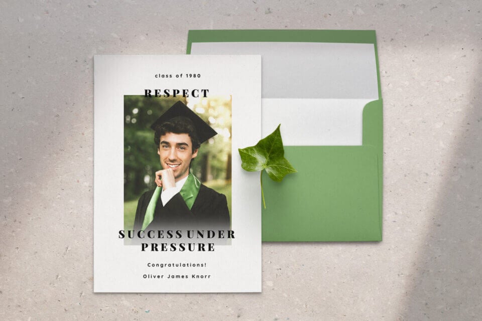 A Green Graduation Announcement card and its accompanying envelope, featuring a custom photo of a man dressed in graduation attire. 
