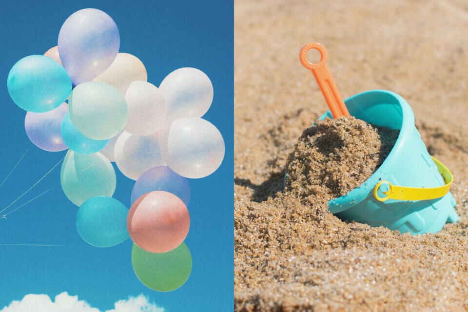 Balloons in the sky, sand and kids bucket 