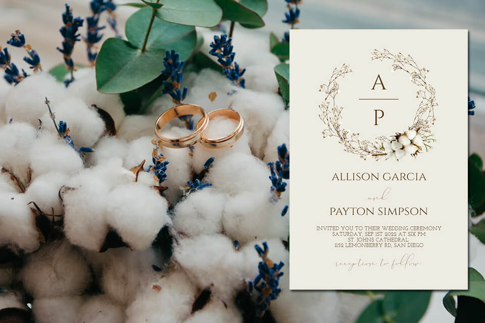 Elegant Winter-themed Wedding Invitation in Cream, Adorned with a Wreath of Flowers and Delicate Floral Details. Paired with a Breathtaking Winter Flower Arrangement Featuring Two Golden Rings.