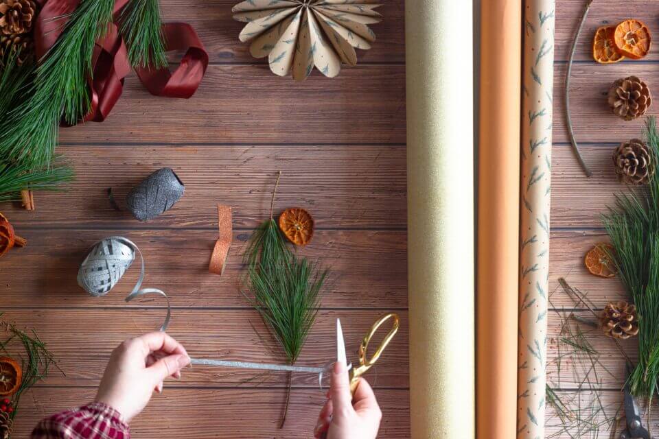 Overhead Shot of Someone Arranging Christmas Ornaments and Decorations