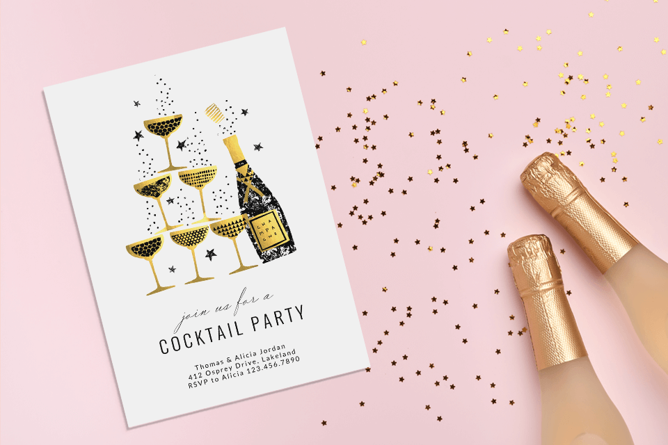 a champagne themed party invitation with two champagne bottles close by