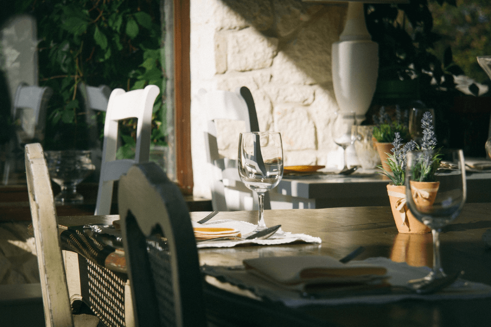 An elegant restaurant setting with a minimalist design, featuring clean lines, subdued colors, and tasteful table arrangements that speak of refined simplicity.