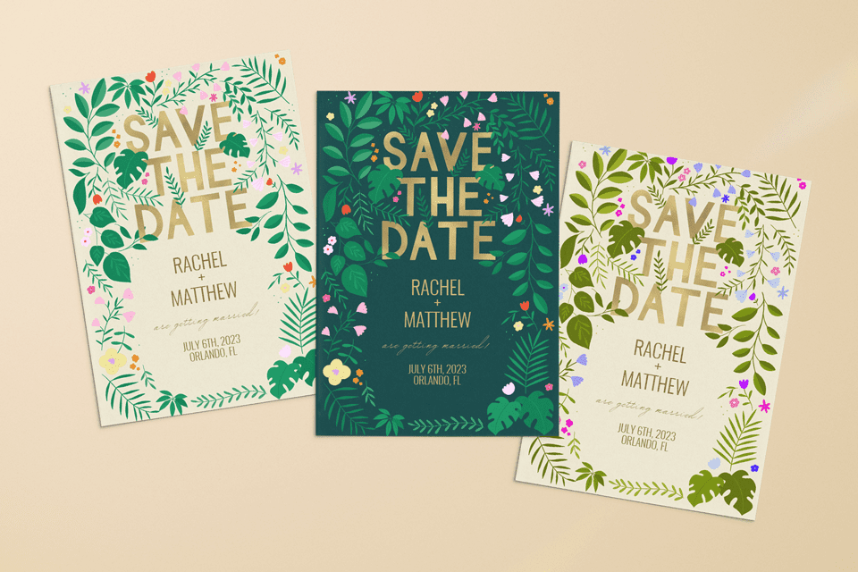 mock-up-3-cards "Triad of 'Save the Date' invitations by Isabel Serna - Black Lamb, each with a unique color scheme, showcasing jungle greenery, gold text, and specks of tiny flowers in pink, orange, red, and yellow for Greetings Island.