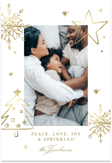 Capturing the essence of family perfection in a central holiday card masterpiece: a radiant photograph surrounded by elegant gold line drawings of Christmas trees and snowflakes.