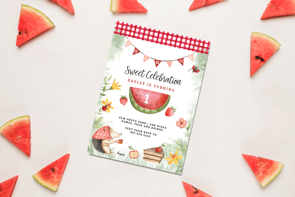 Cheerful Watermelon-Themed Summer Birthday Invitation: A Vibrant Illustration Featuring a Number 1 in the Center, Accented by Flowers and Strawberries for a Picnic Vibe, Resting on a Light Grey Surface with Freshly Cut Watermelon Slices