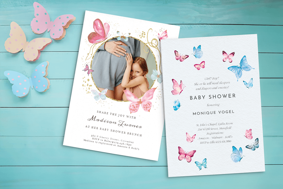 Baby shower invites on teal wooden surface, adorned with butterflies. One features girl with mommy's belly, the other pink and blue butterflies.