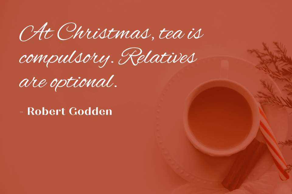 A mug of Christmas tea with a candy cane. The quote "At Christmas, tea is compulsory. Relatives are optional." by Robert Godden is written on top of the shaded image