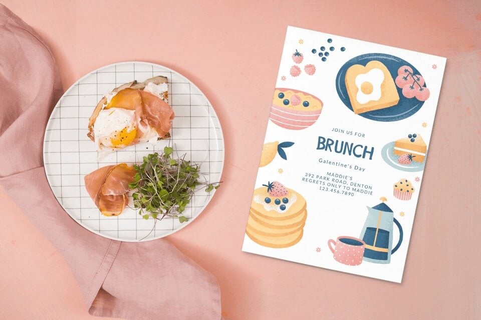 Join Us for Brunch on Galentine's Day with a charming invitation featuring illustrations of pancakes, cake, toast, and eggs, placed on a tabletop beside a delectable plate of food.
