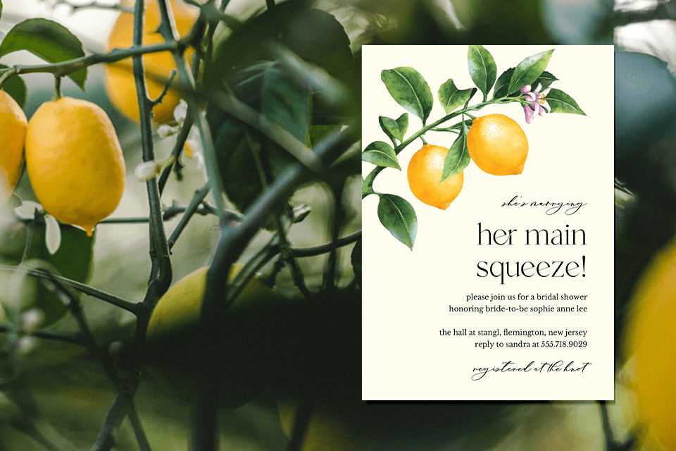 Invitation to 'Her Main Squeeze' Bridal Shower: Featuring an enchanting illustration of a lemon branch with two vibrant lemons, symbolizing zest and love. Set against a backdrop of a real lemon tree adorned with ripe fruits
