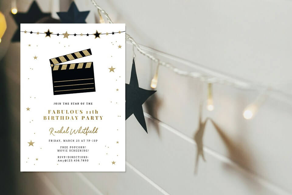 movie-night-invite-garland-string-lights (2) Elegant movie night birthday invitation with a gold and black clapperboard design, surrounded by gold stars, placed against a background of black star garland and string lights.